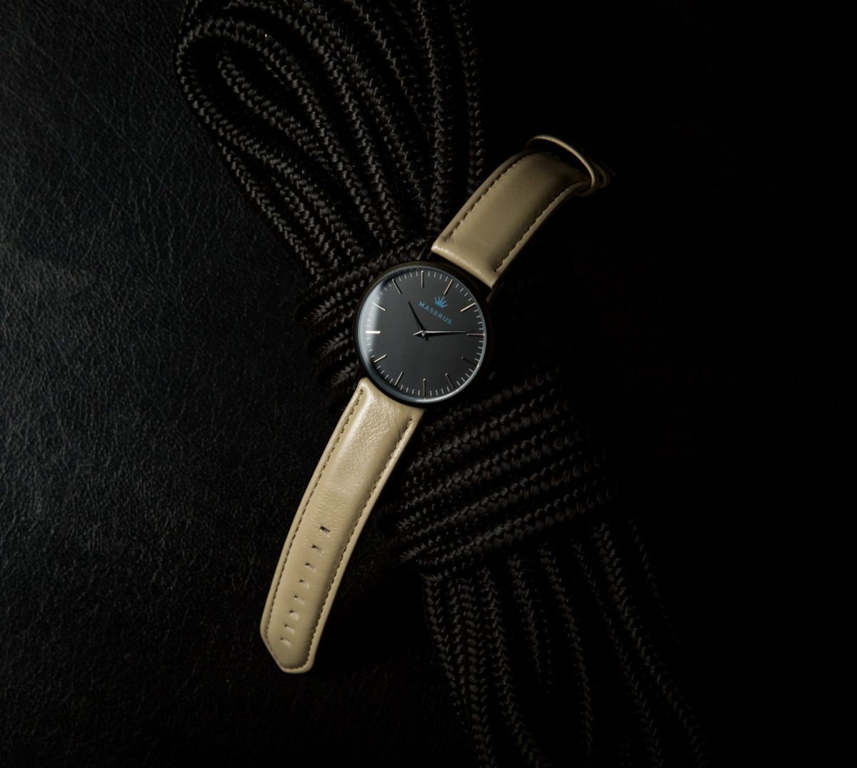 Product image two of mens black case, tan leather strap watch on rope.