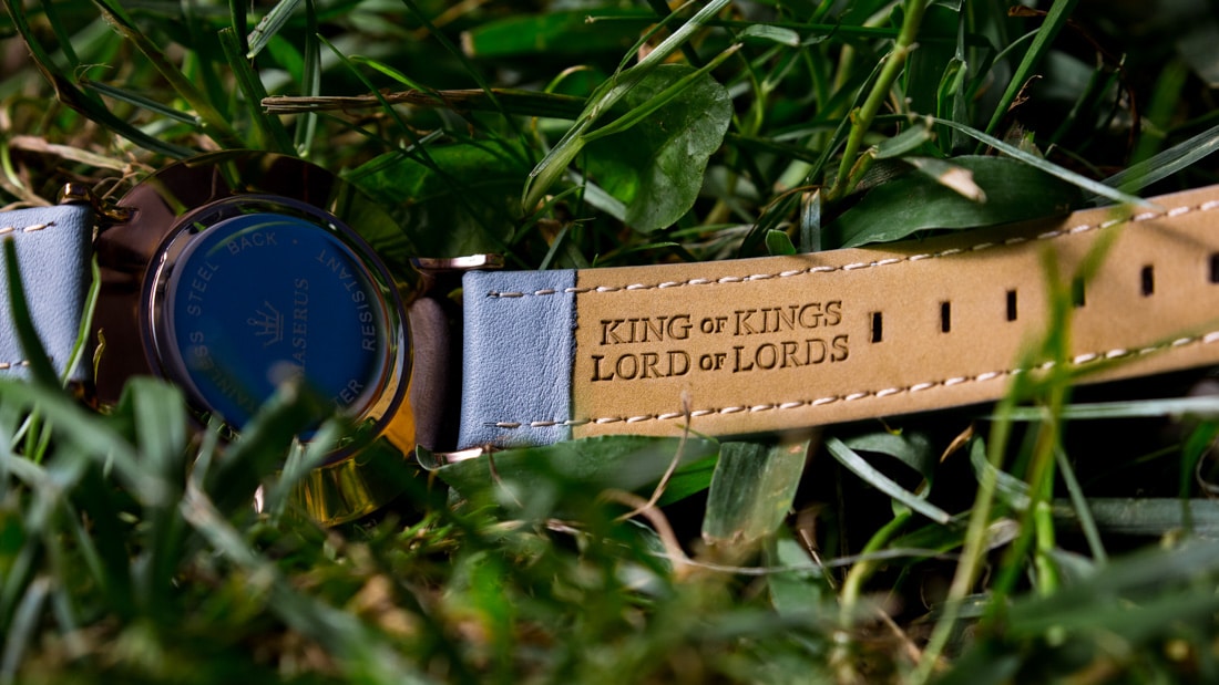 Back of watch strap that reads "King of Kings Lord of Lords".