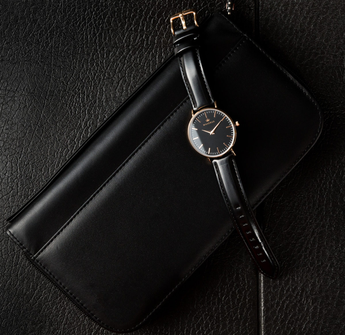 Product image one of womens rose gold, black leather strap watch on case.