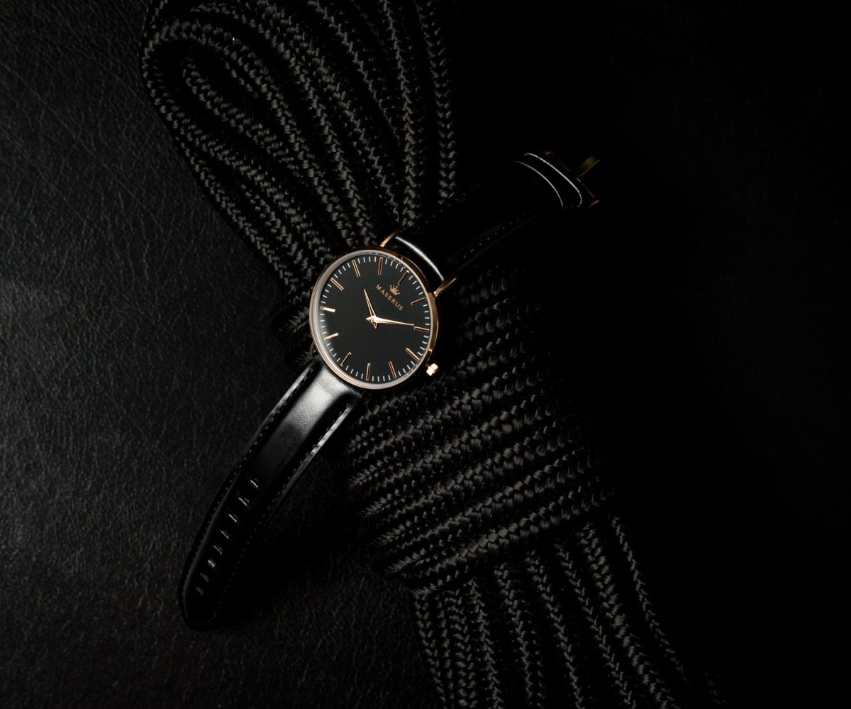 Product image two of womens rose gold, black leather strap watch on rope.