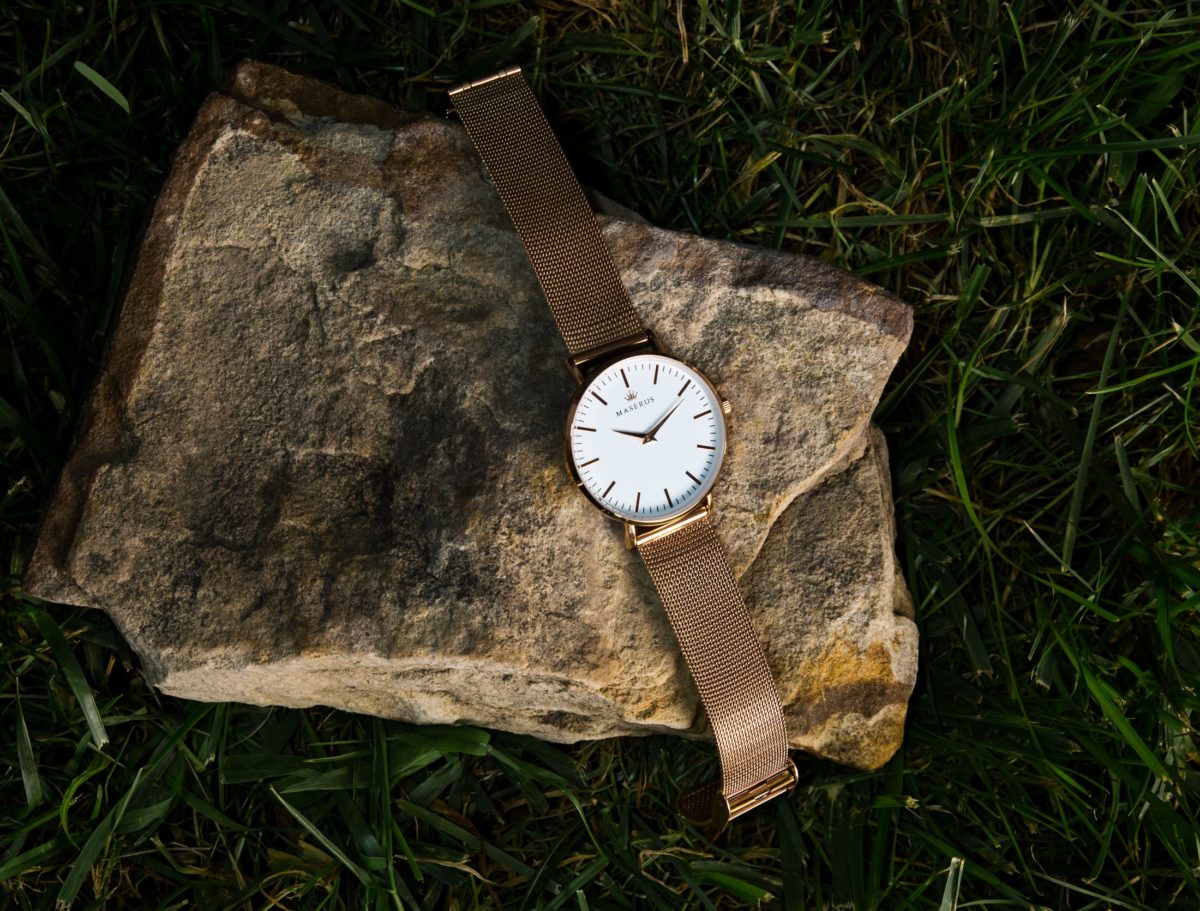 Product image two of womens rose gold mesh watch on stone.